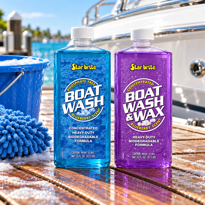 Star brite Boat Wash and Boat Wash & Wax bottles beside a blue wash mitt and bucket at a marina.