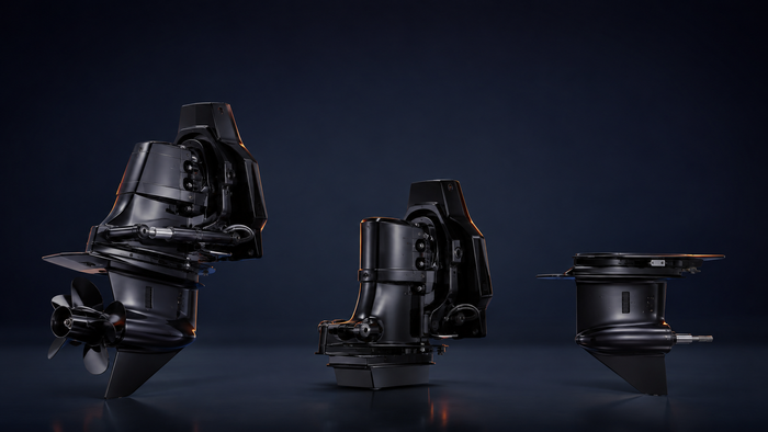 Complete sterndrive shown beside separate upper and lower drive assemblies