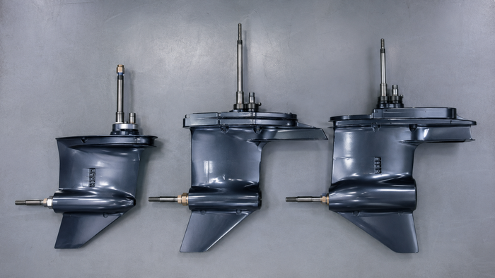 Suzuki DF200, DF225 and DF250 outboard lower unit gearcases arranged side by side for compatibility comparison