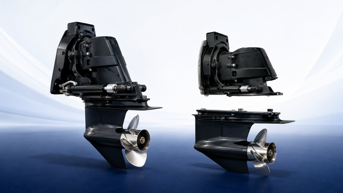 Complete Alpha One Gen II-style sterndrive beside separate upper and lower unit assemblies