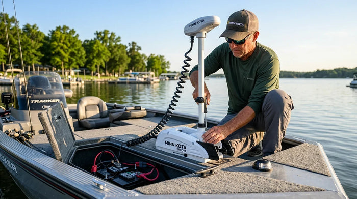 Angler installing a Minn Kota Terrova bow-mount trolling motor on a fishing boat while