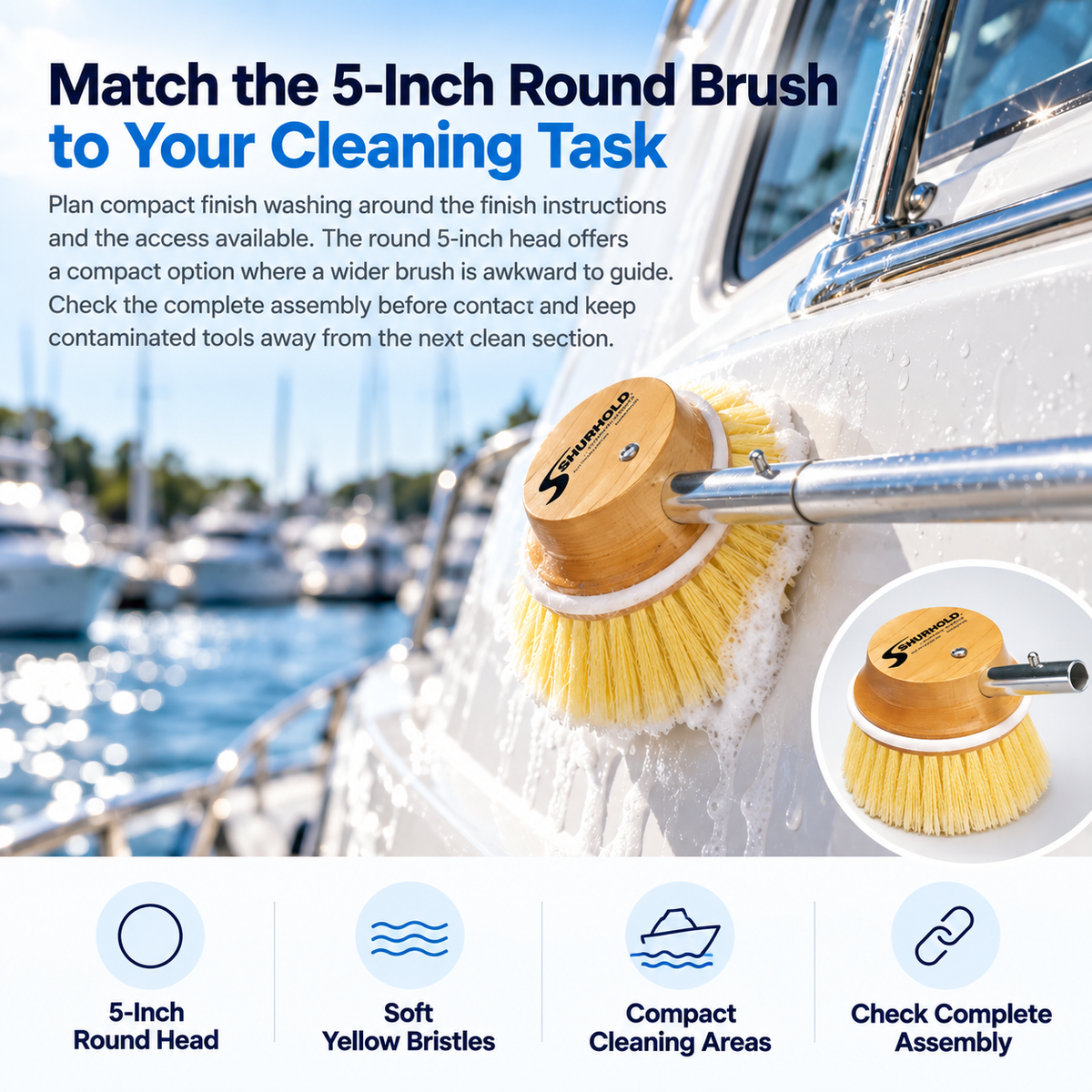 Shurhold 50 5-inch round soft brush with yellow bristles washing a white yacht cabin side below a window.