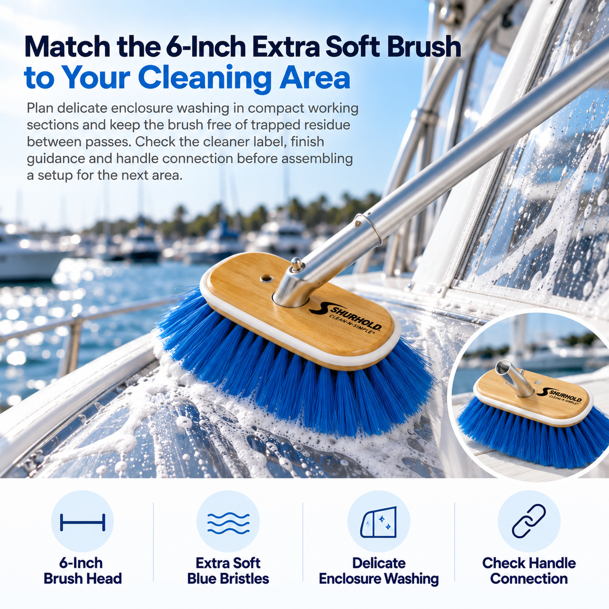 Shurhold 970 6-inch extra soft brush with blue nylon bristles and a wooden head washing a soapy yacht enclosure panel.